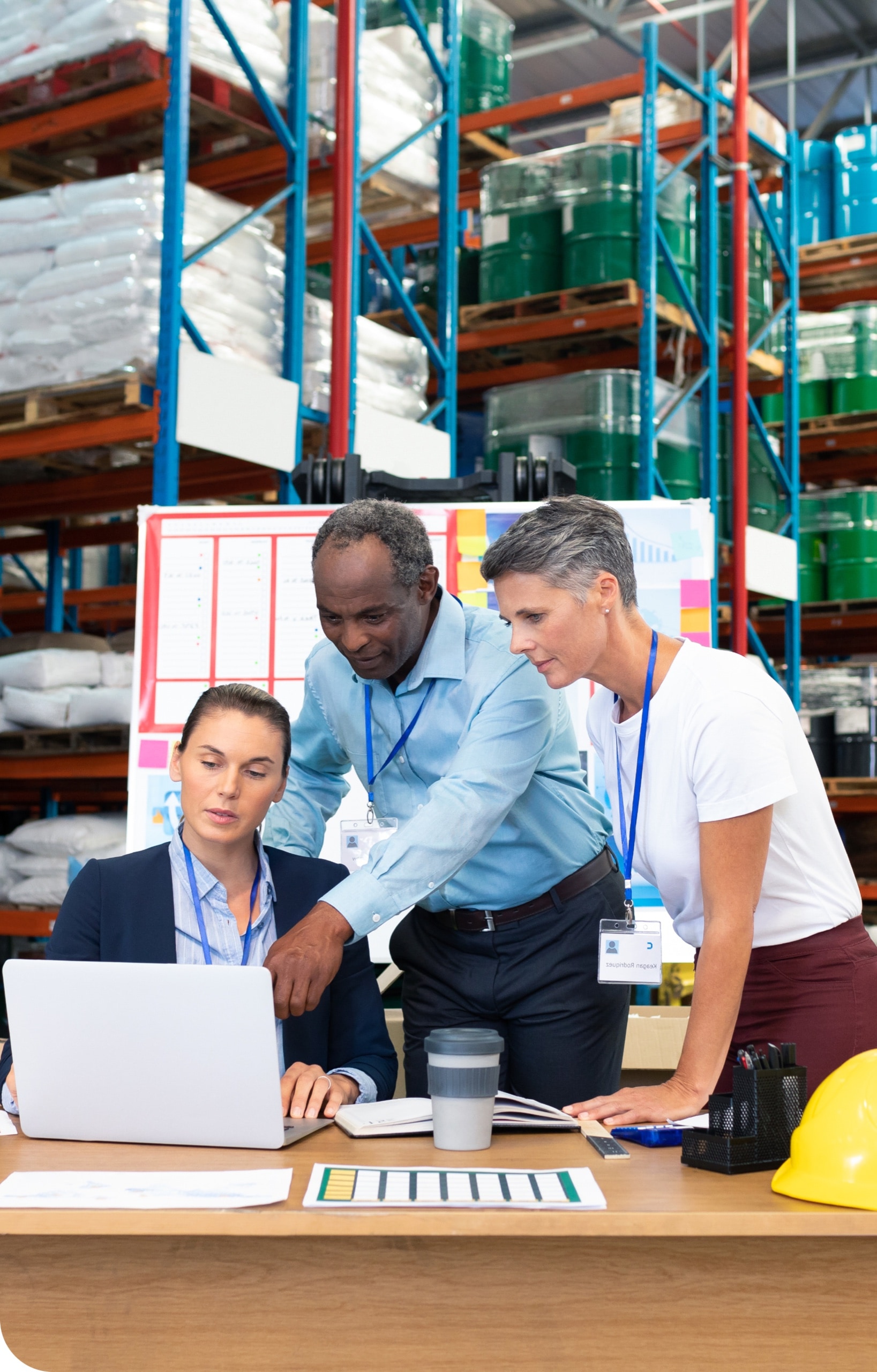 WMX logistics team reviewing operations in a warehouse